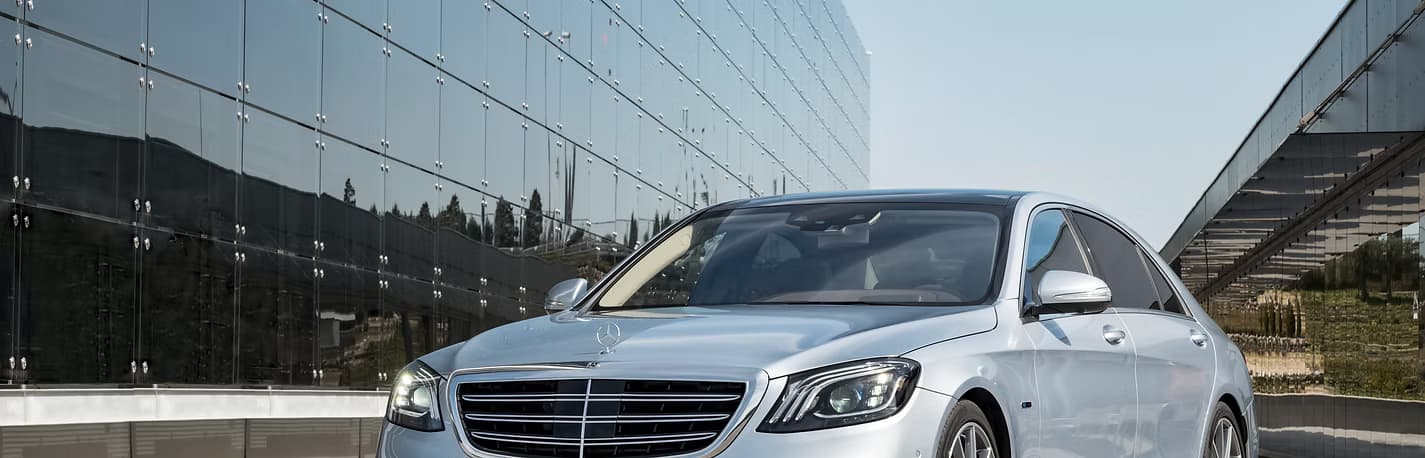 Luxury vehicle at modern building